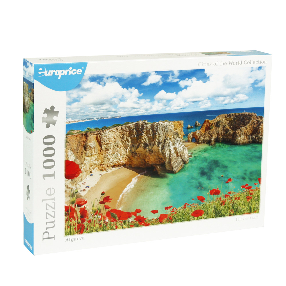 Caixa do puzzle Cities of the World - Algarve. Revela uma praia deserta na região sul de Portugal. Com águas azuis e praia de areia fina, falésias como pano e fundo e papoilas vermelhas em primeiro plano.